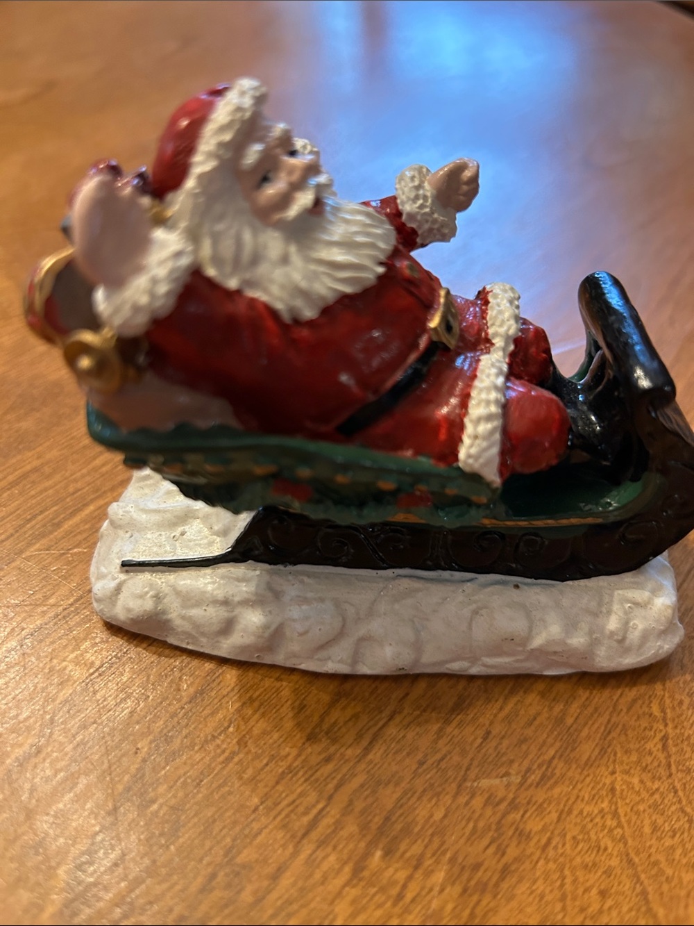Source Unknown Red Santa on Green Sleigh Figurine